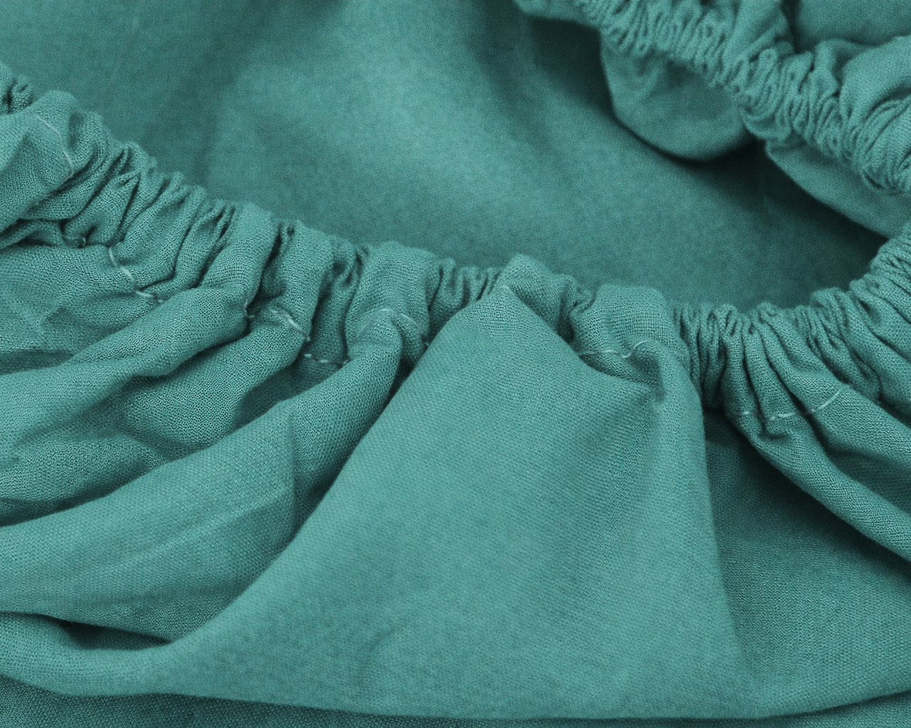 Tecido verde água com bainha elástica e textura suave