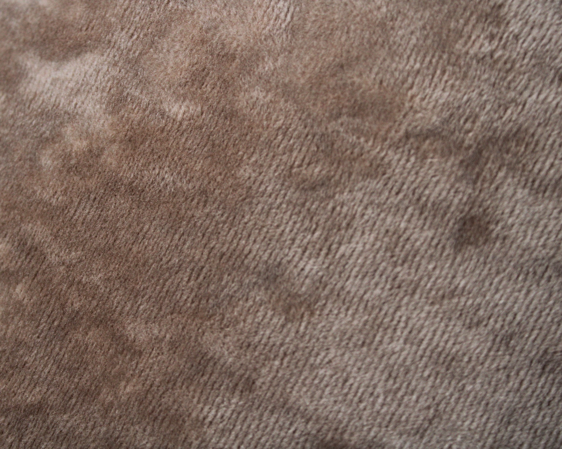 Tecido castanho claro com textura suave e padrão em relevo