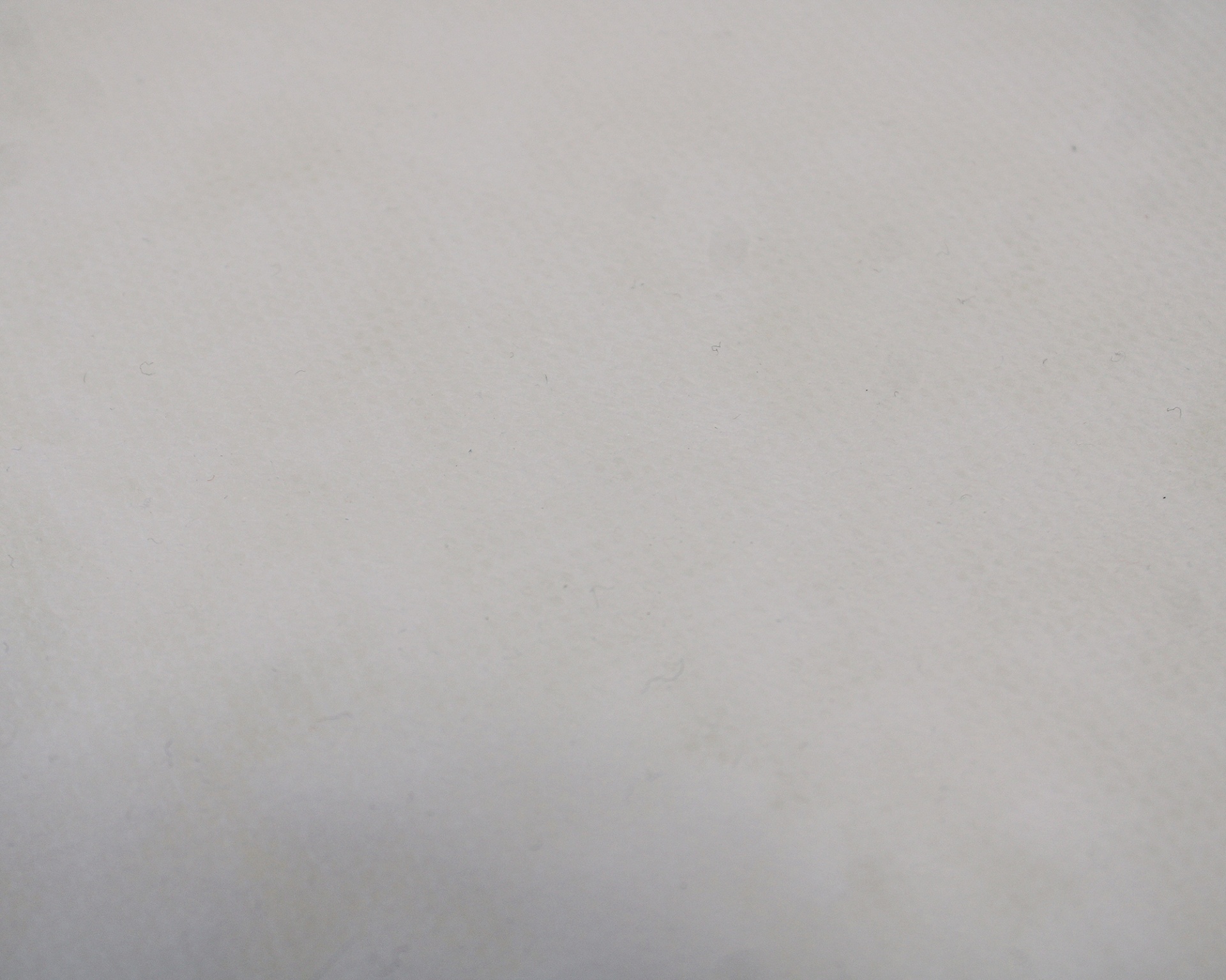 Superfície branca texturizada com pequenas fibras