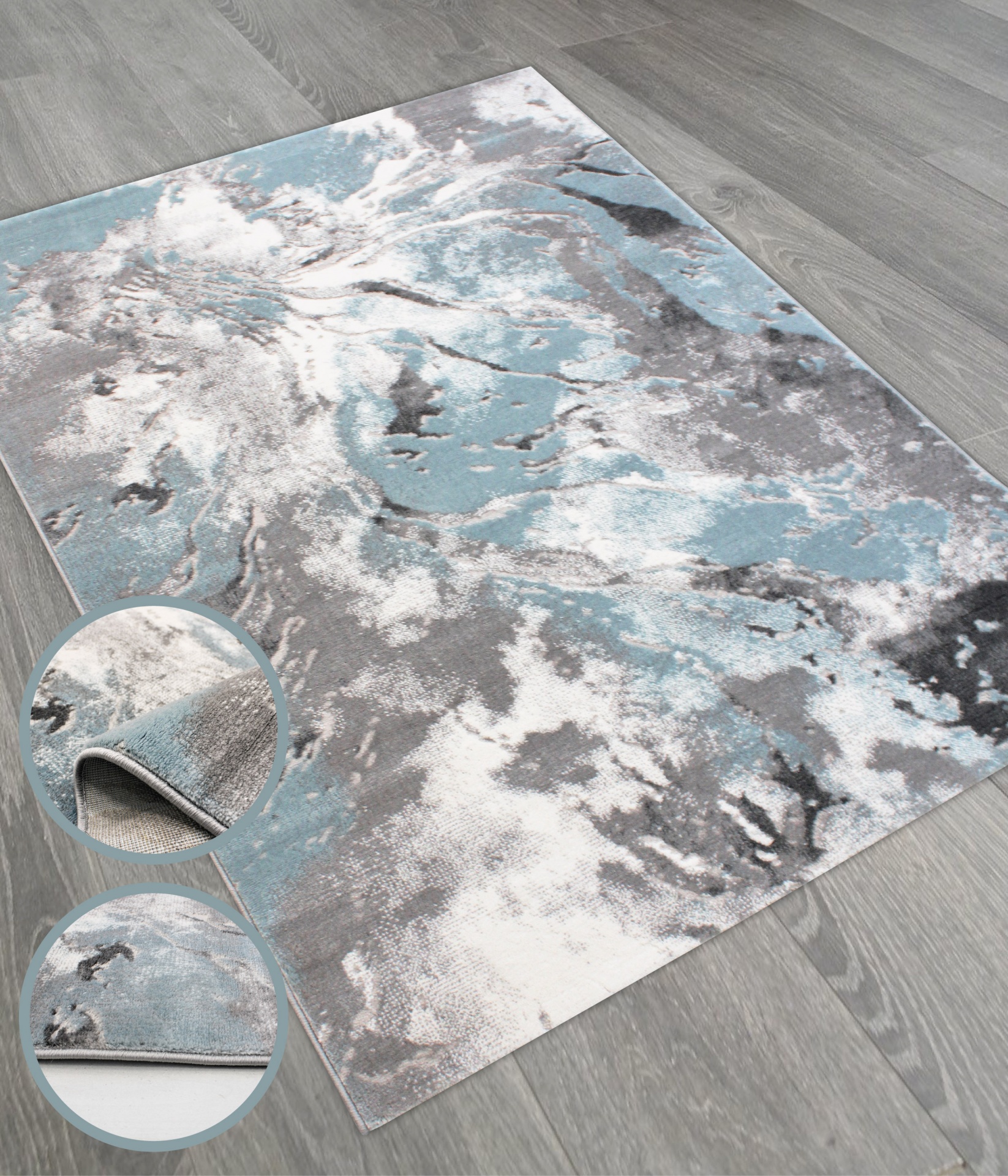 Tapete retangular com padrão abstrato azul, branco e cinza, detalhado em círculos com tecido e bordas.