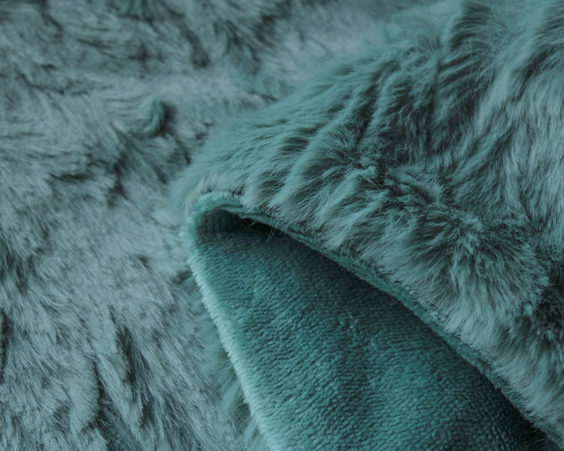 Tecido felpudo azul esverdeado com textura macia
