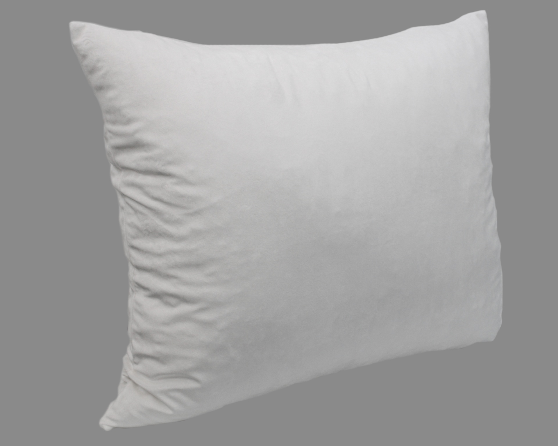Travesseiro branco retangular sobre fundo cinzento