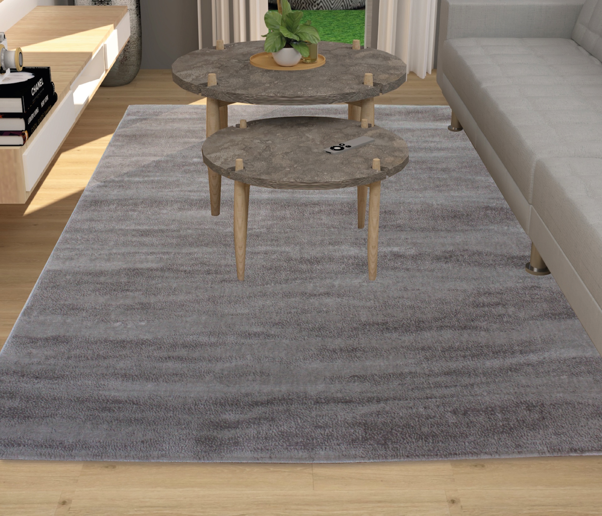 Tapete cinza com mesas de centro redondas e sofá ao lado num ambiente de sala