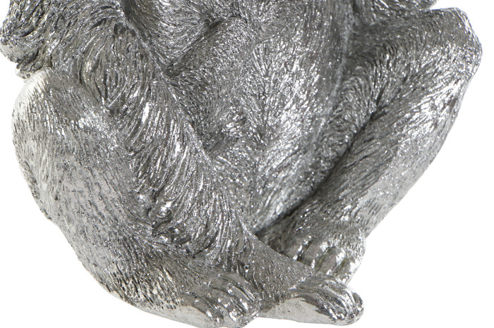 Escultura prateada de um macaco sentado com textura detalhada