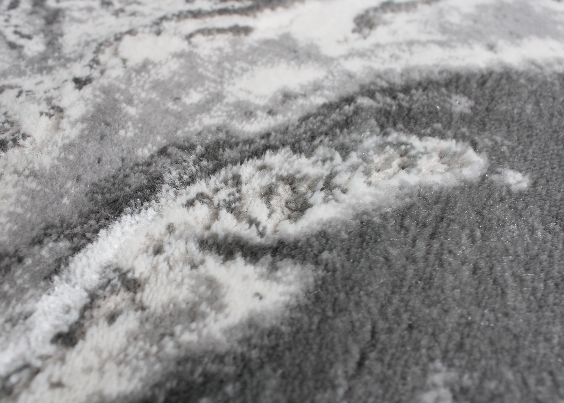 Tecido cinzento com padrão abstrato branco e cinza claro absorvente