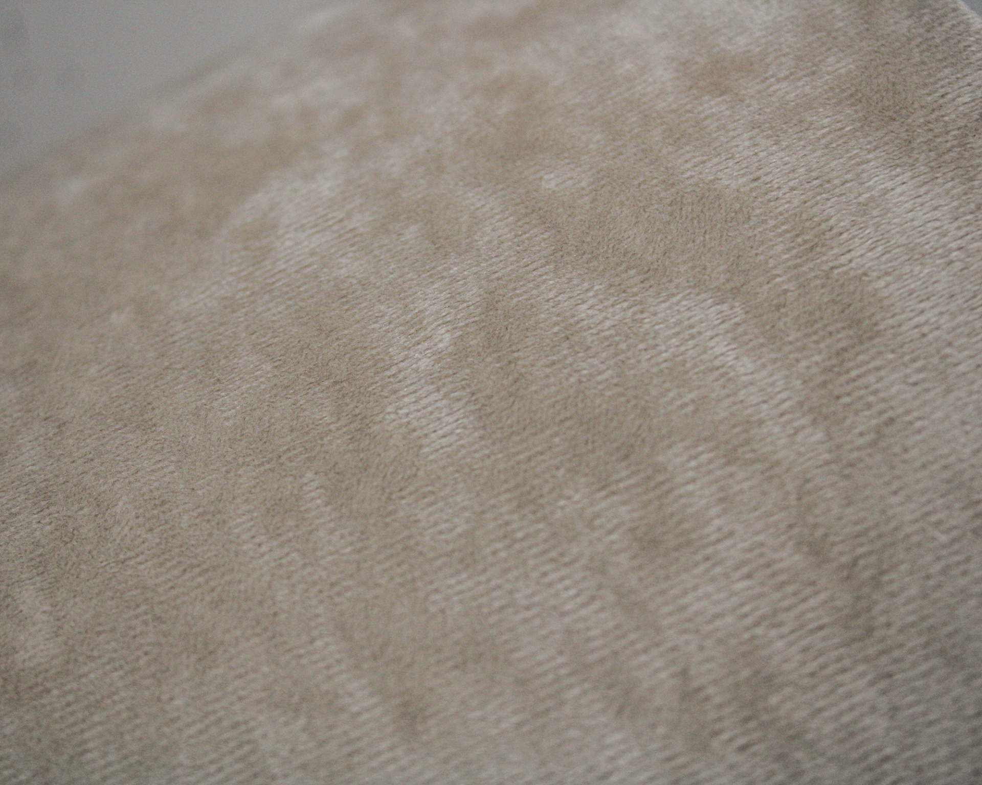 tecido bege claro com textura suave e padrão irregular