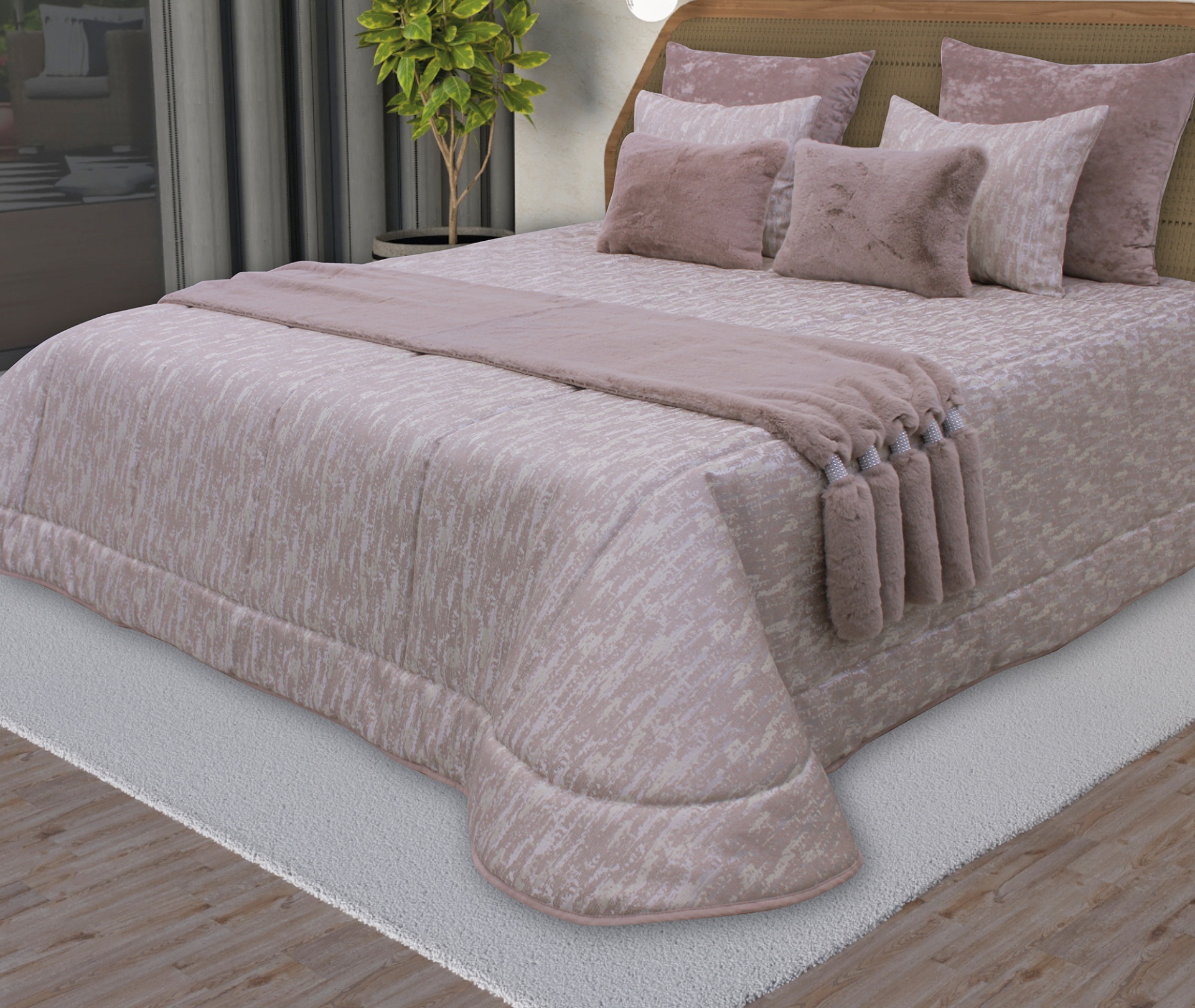 Cama com edredão e almofadas rosa claro e tapete branco