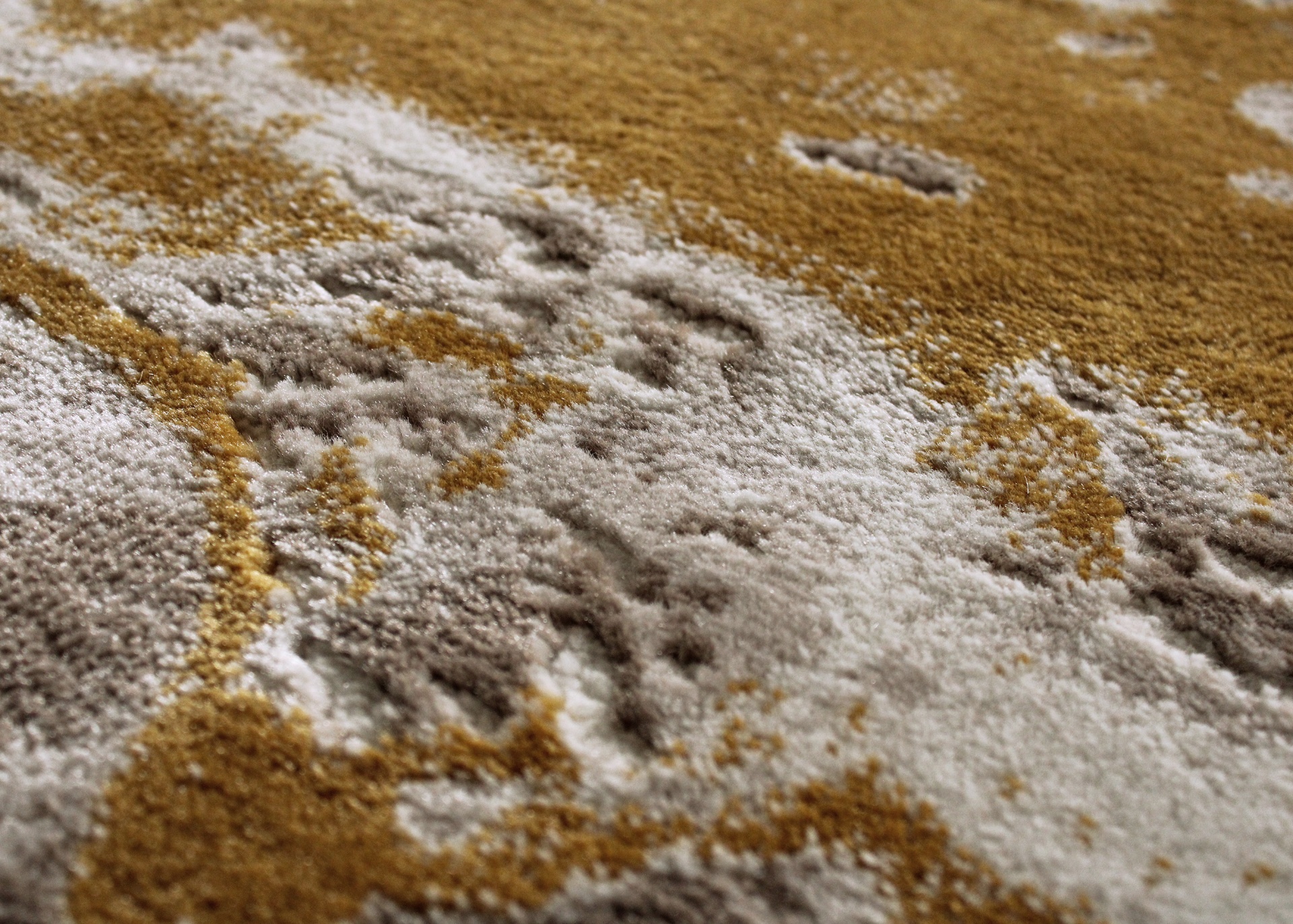 Textura de tapete castanho, bege e creme com padrão abstrato