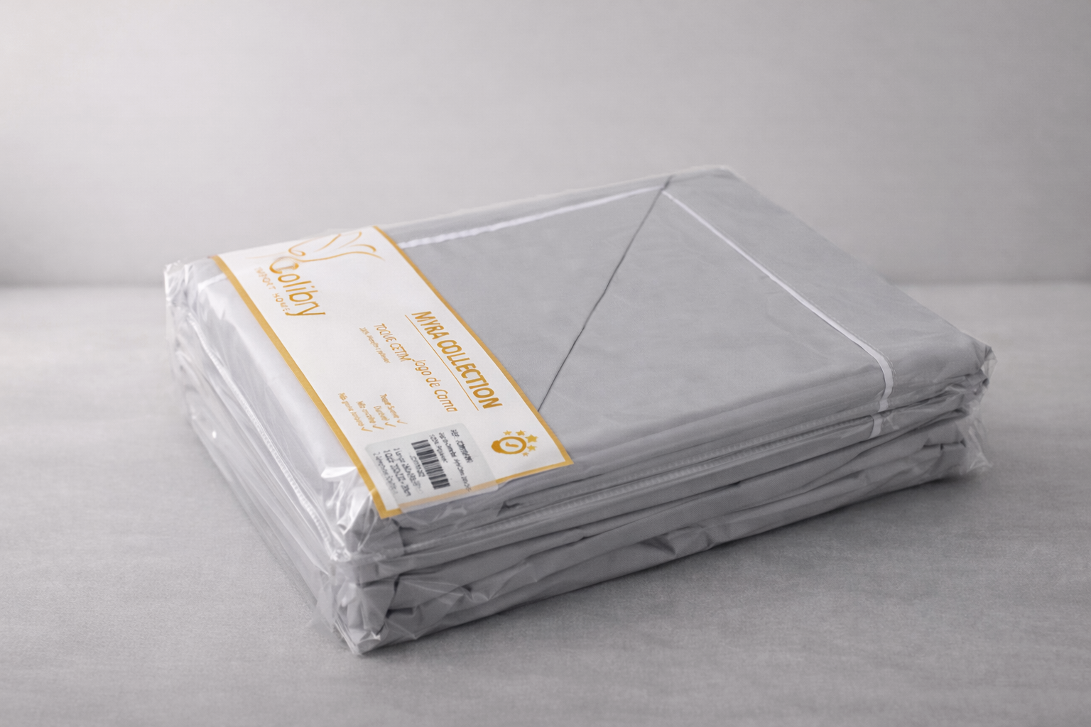 Lençóis cinzentos embalados com etiqueta da coleção MIRA COLLECTION da Coliby.