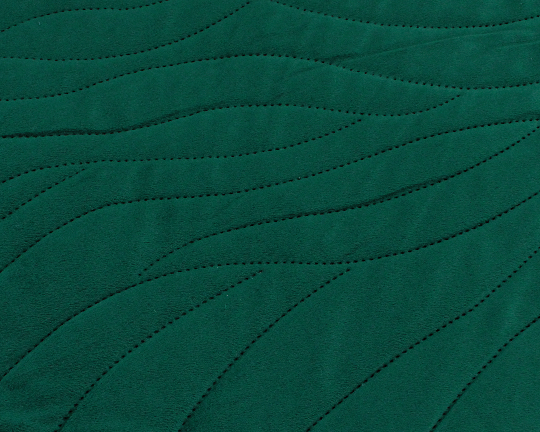 Tecido verde com padrão ondulado perfurado