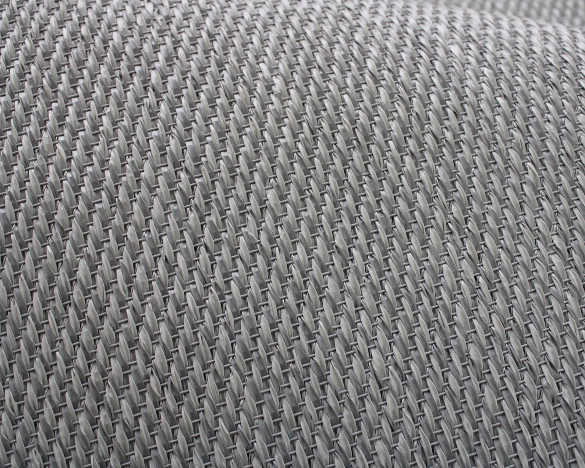 Tecido cinzento claro com padrão entrelaçado