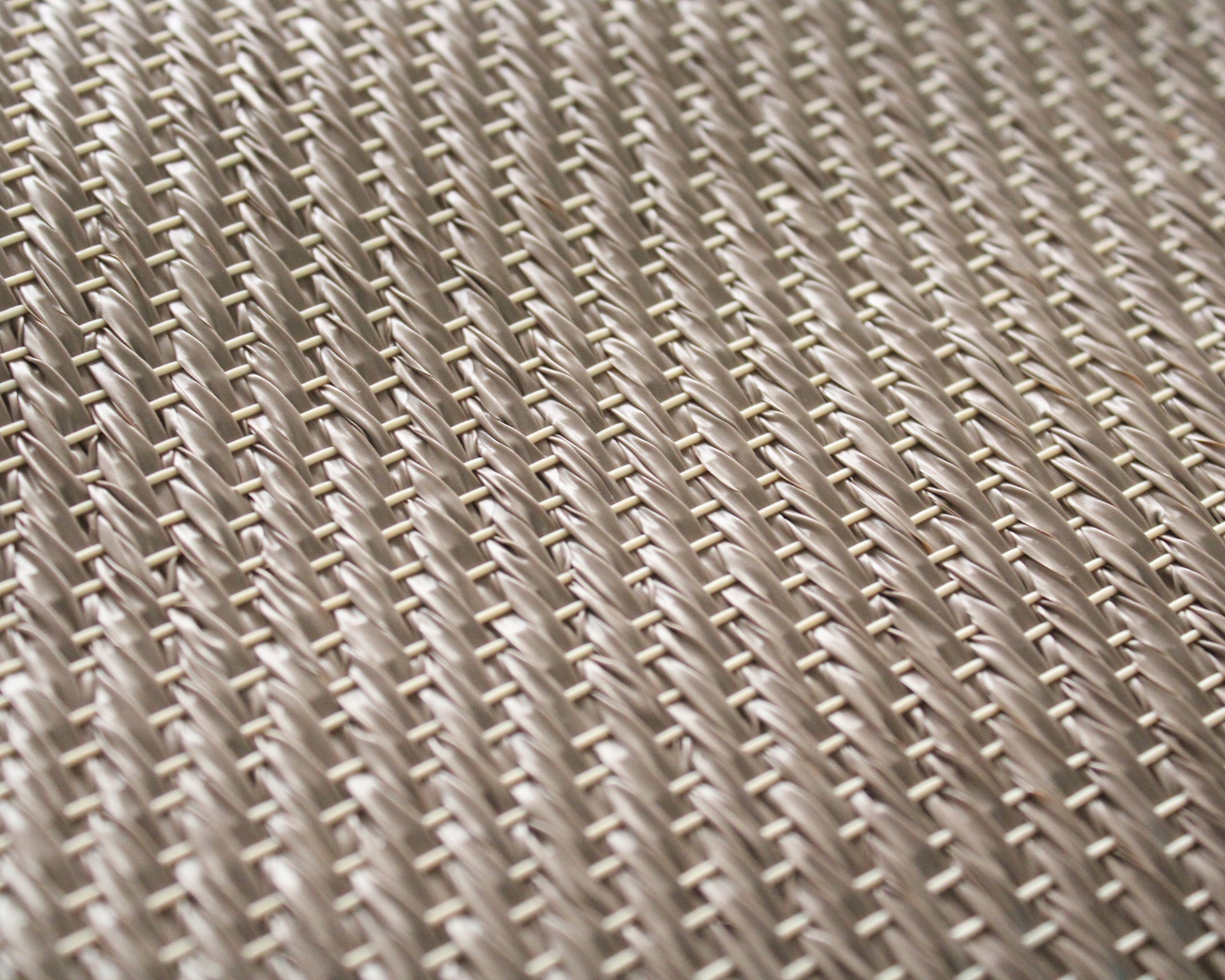 Pano bege com padrão entrelaçado diagonal