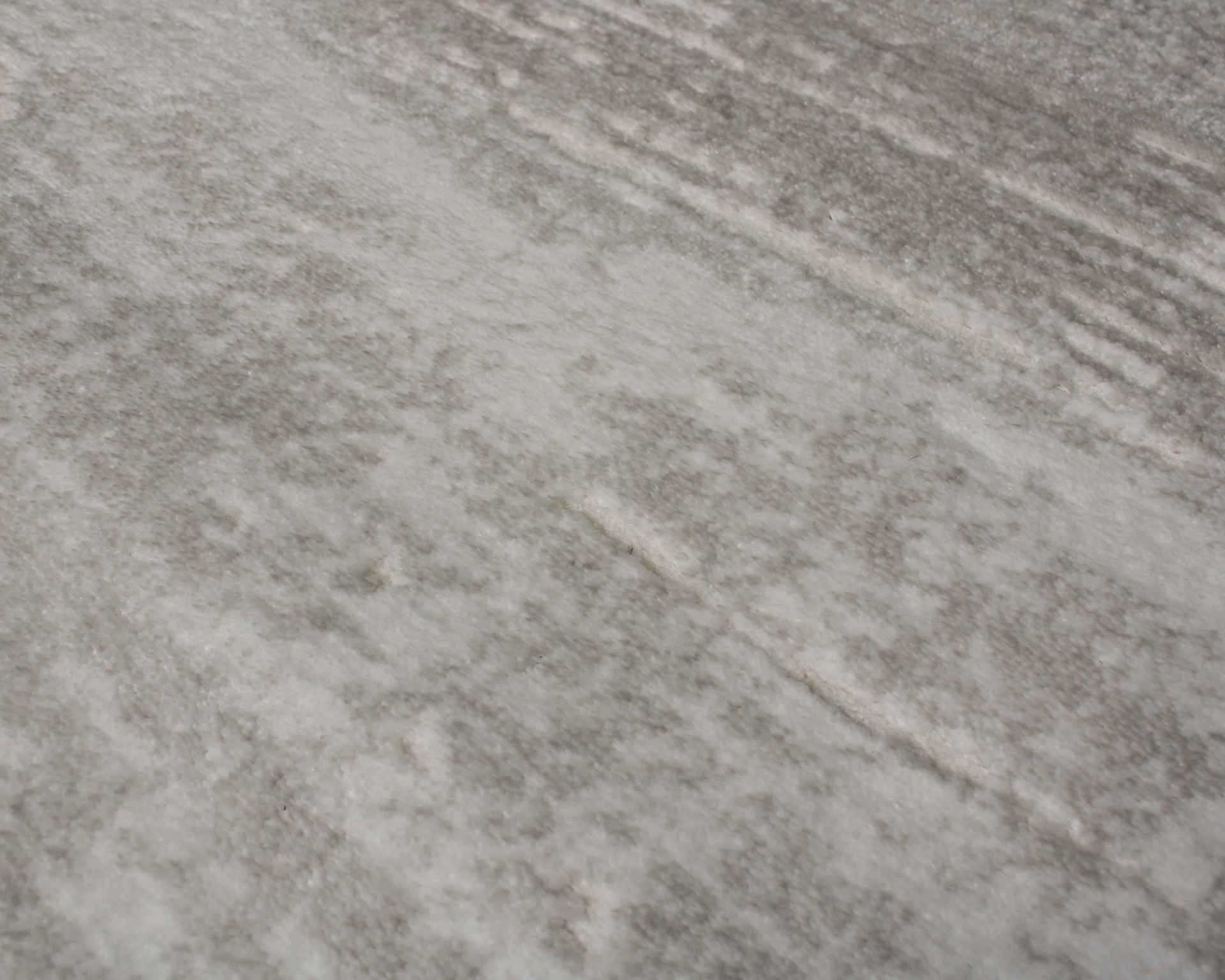 superfície texturada cinza claro com padrão irregular