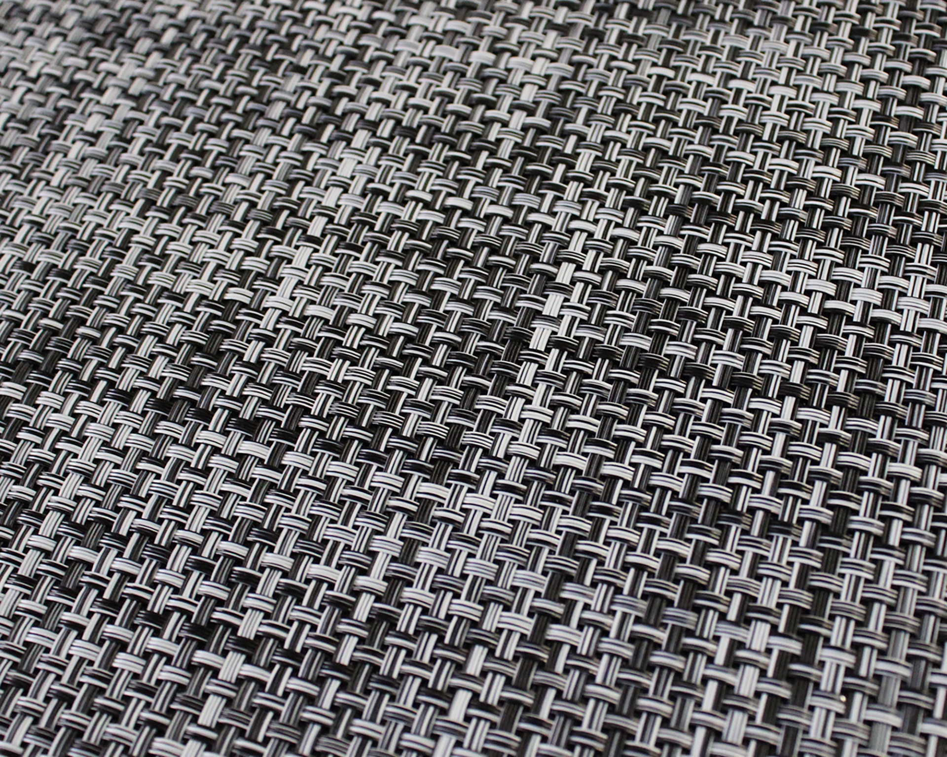 Padrão de tecido entrelaçado em preto, cinzento e branco