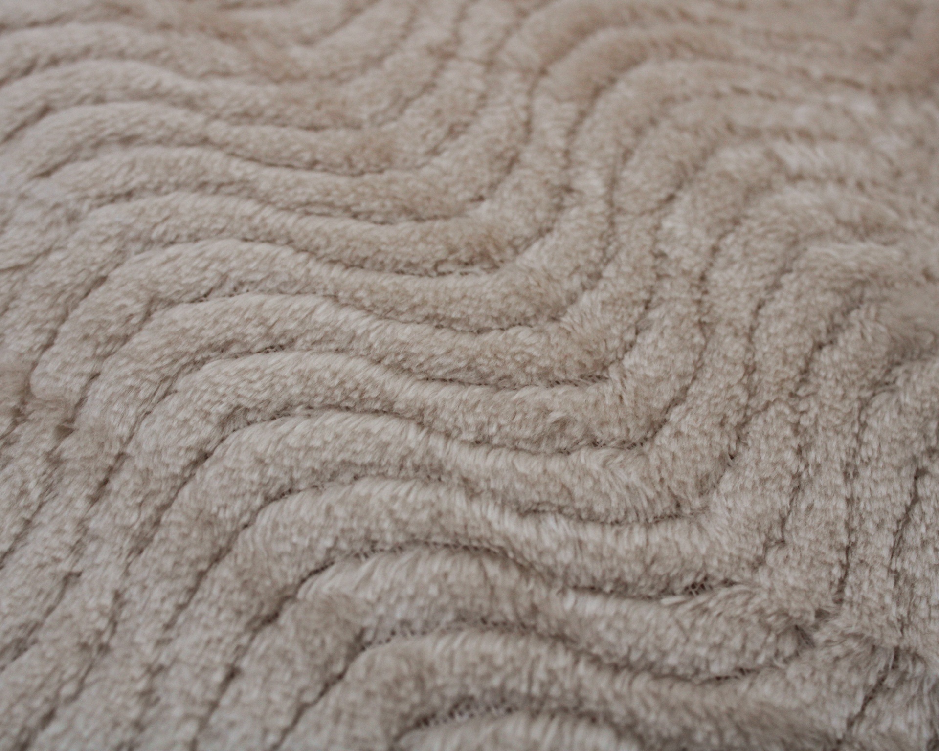 Tecido bege com padrão ondulado texturizado