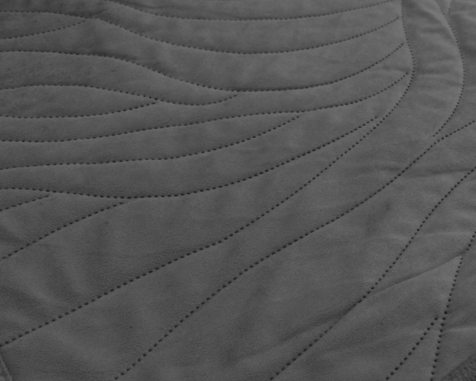 Textura cinzenta escura com linhas onduladas perfuradas