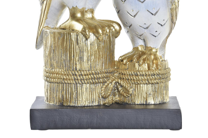 Base preta com escultura dourada e branca de garras de pássaro e tronco