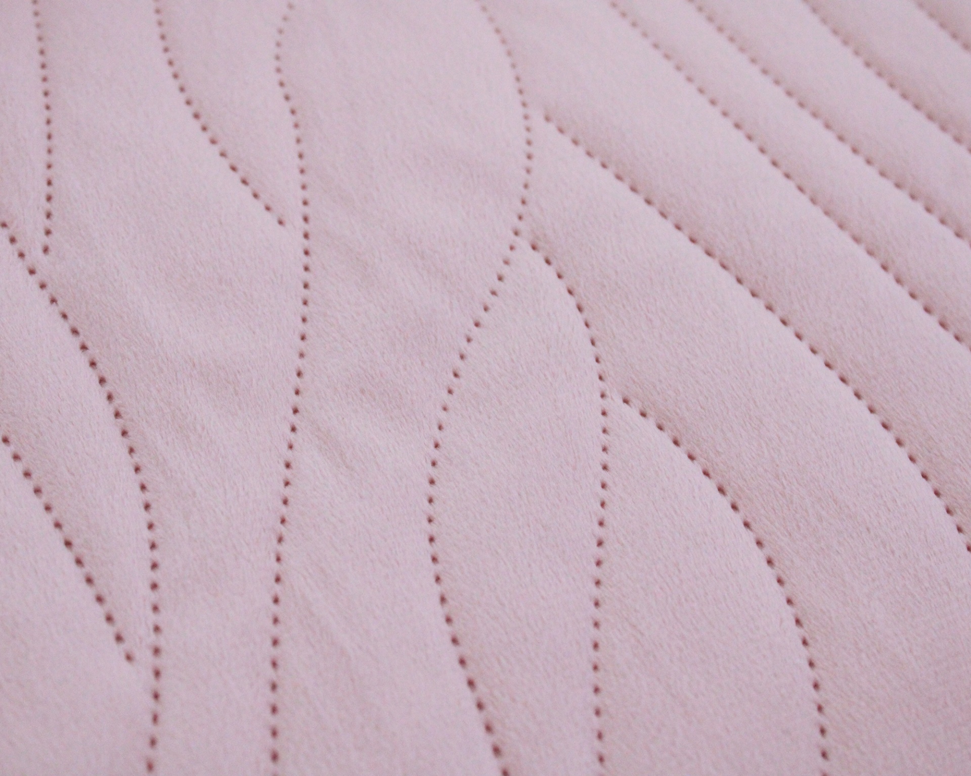 Tecido rosa com padrão ondulado de costura