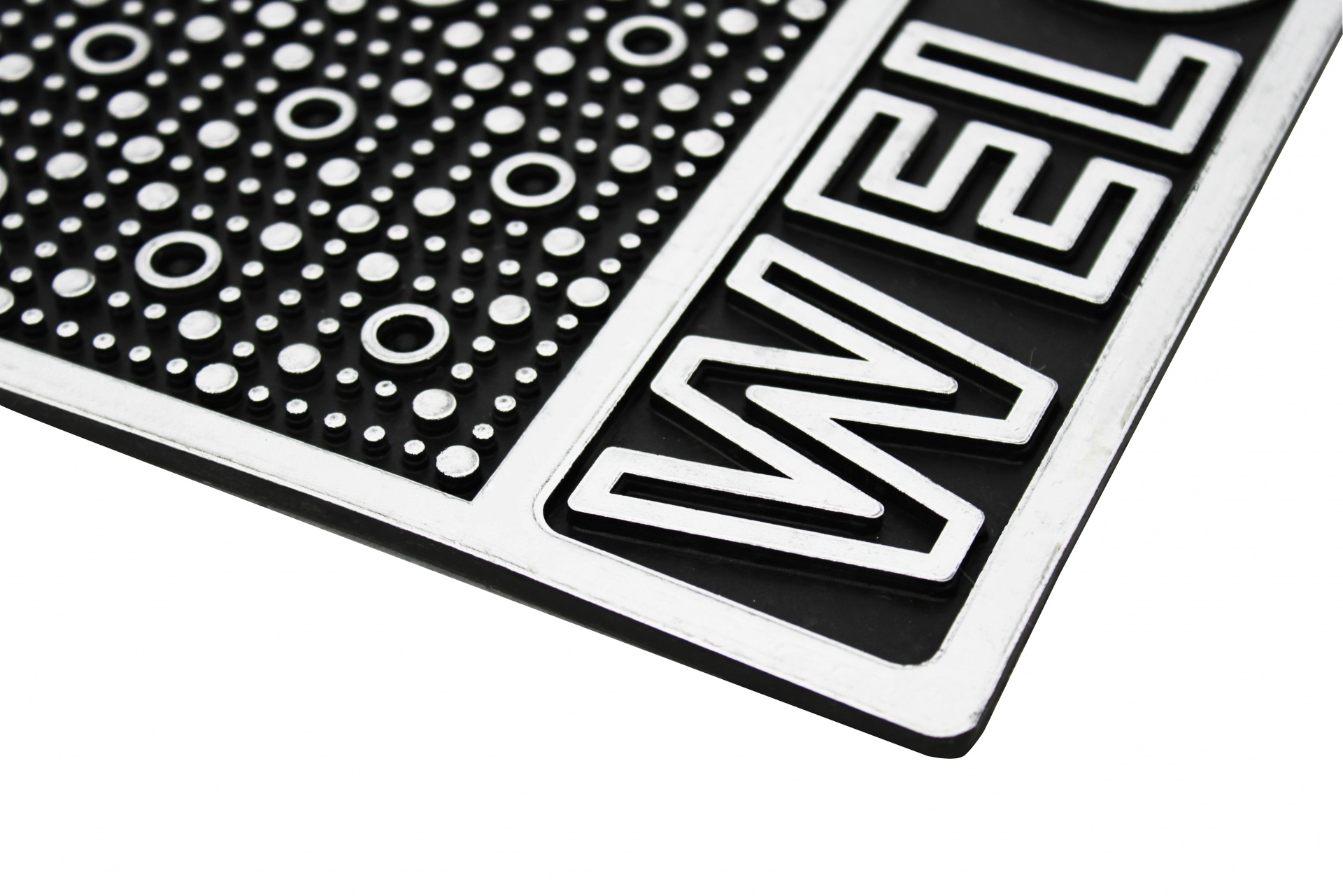 Tapete de entrada preto e branco com padrão de círculos e a palavra WELCOME