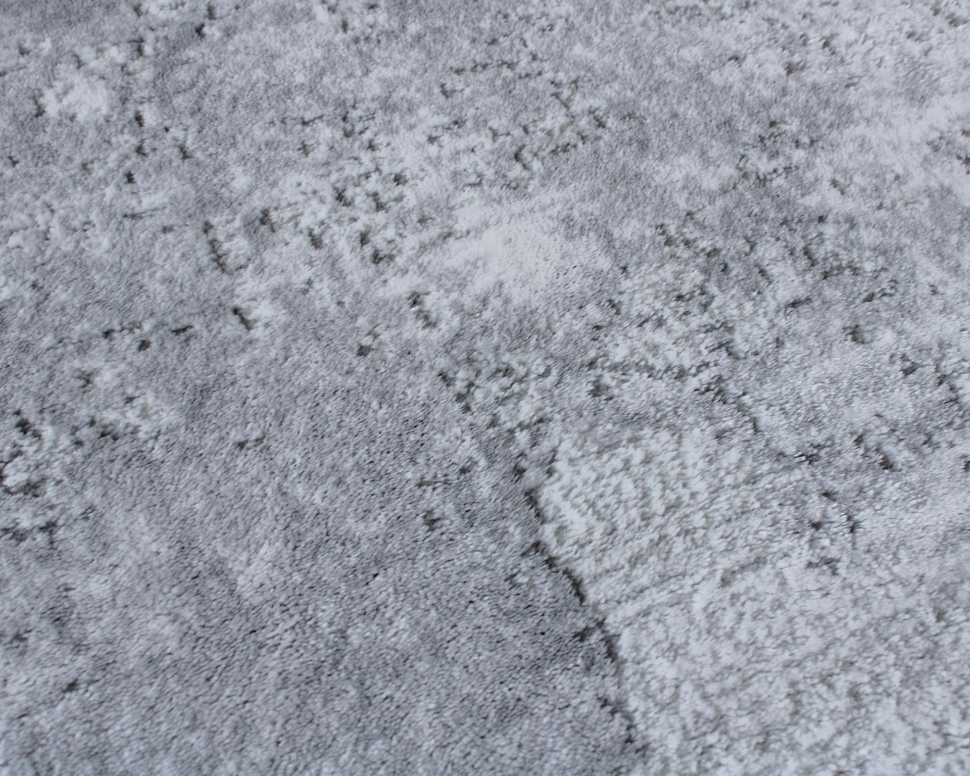 Superfície texturizada cinzenta com padrão irregular