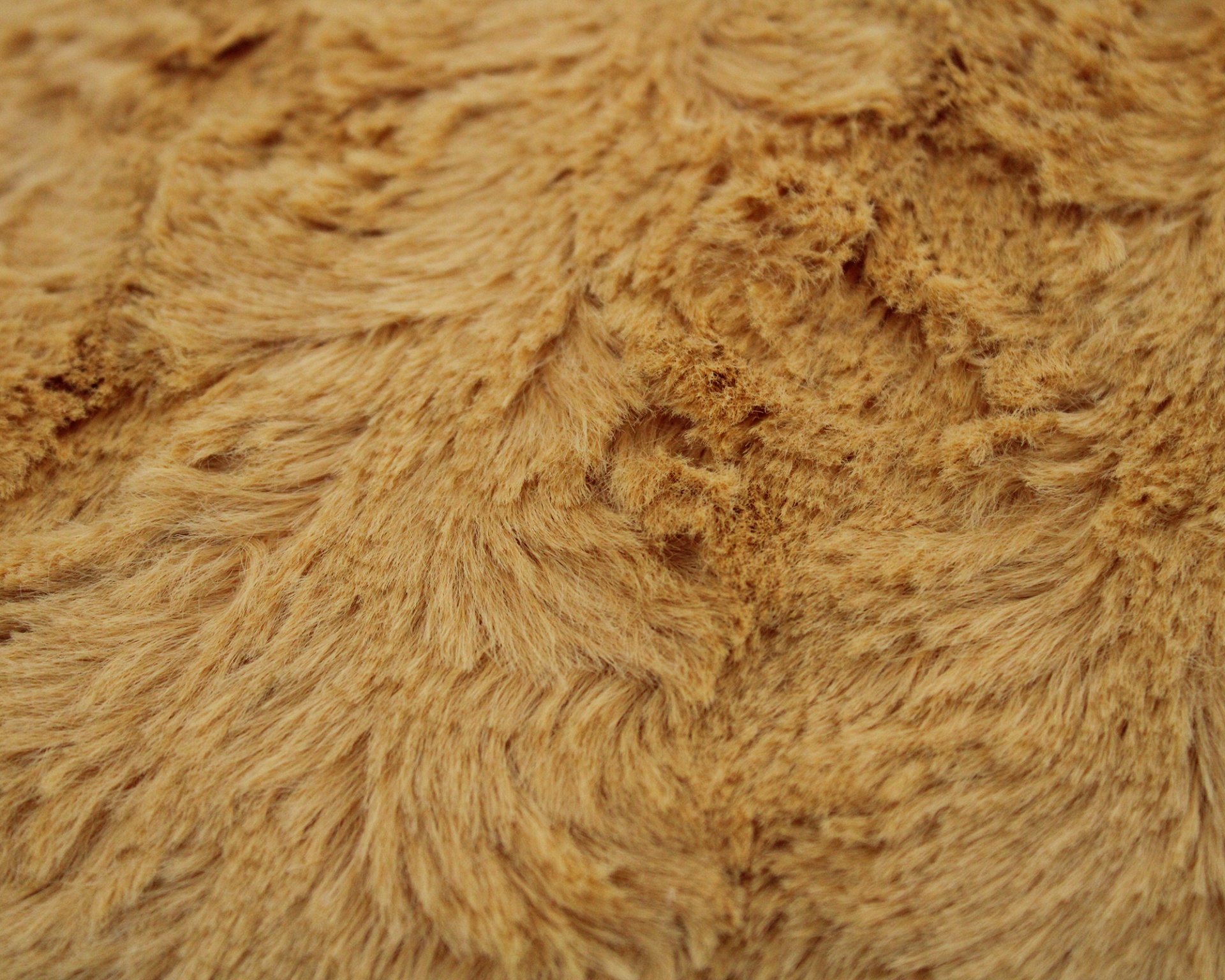 Tecido peludo castanho claro com textura irregular