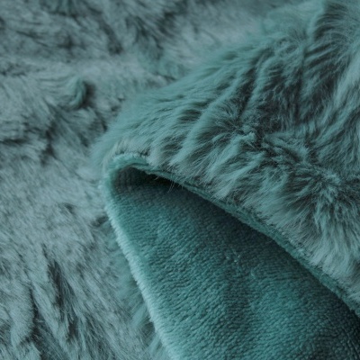 Tecido felpudo azul esverdeado com textura macia
