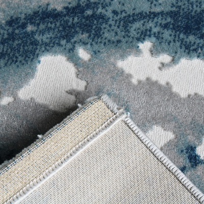 Tapete azul, cinza e branco com padrão abstrato e verso em trama bege