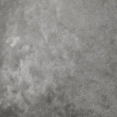 Tecido cinzento aveludado com textura e padrão suave irregular