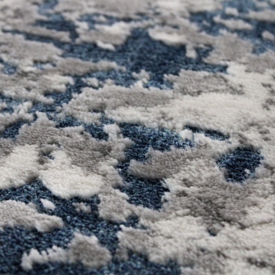 Textura de tapete com padrão abstrato em cinzento e azul