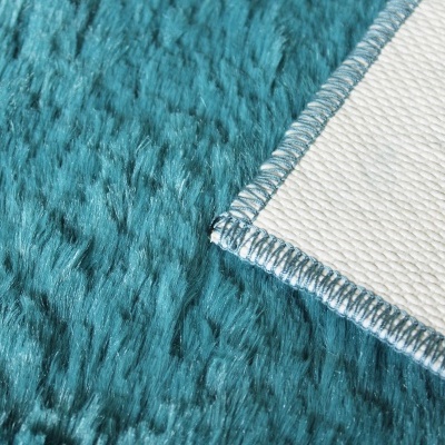 tecido felpudo azul turquesa com verso branco e costura azul
