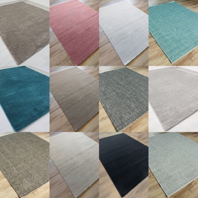Coleção de tapetes retangulares de várias cores sólidas em ambientes interiores