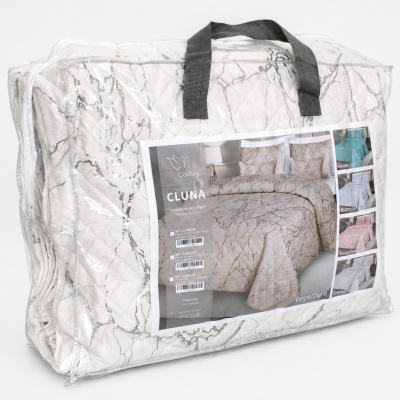 Edredão em veludo branco com padrão cinzento em embalagem transparente com etiqueta e alças pretas.