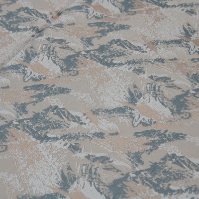 Tecido jacquard com padrão abstracto em azul, bege e branco e textura em relevo