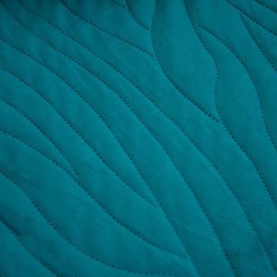 Tecido acolchoado azul-turquesa com padrão ondulado