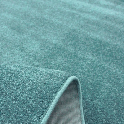 tapete azul turquesa com textura, bordas e parte de trás cinza