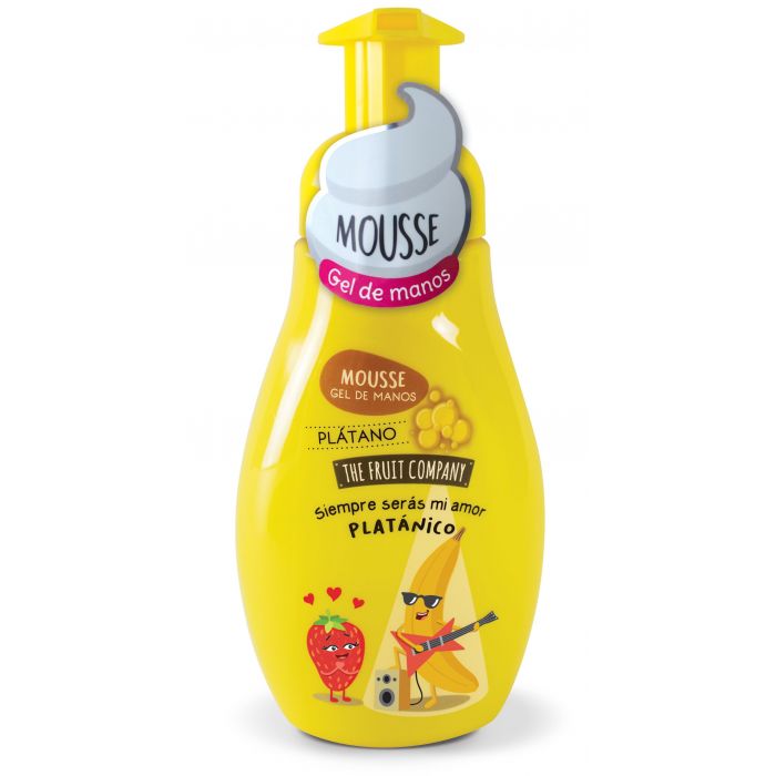 Frasco amarelo de mousse gel para mãos com ilustrações de frutas e texto em castelhano