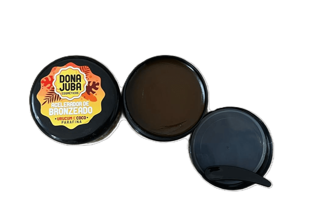 Pote de creme acelerador de bronzeado aberto com tampa e espátula preta ao lado