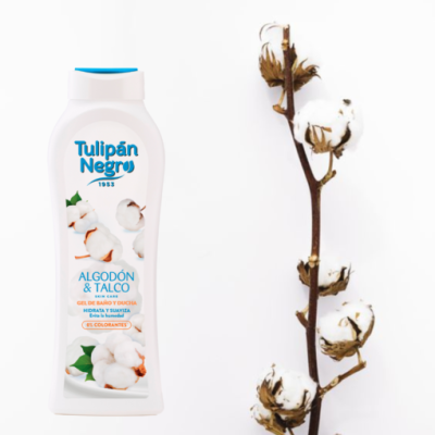 Frasco branco de gel de banho Tulipán Negro ao lado de ramo de algodão