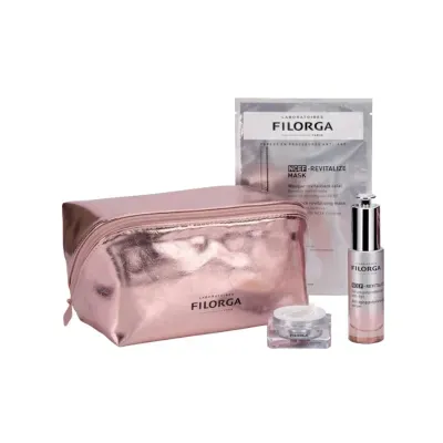 Conjunto de cuidados de pele Filorga com bolsa rosa metálica e produtos de creme, sérum e máscara