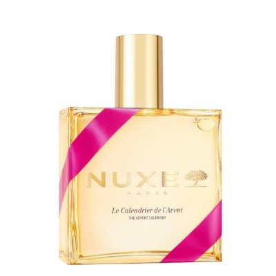 Frasco de perfume NUXE PARIS com fita rosa e tampa dourada em fundo branco