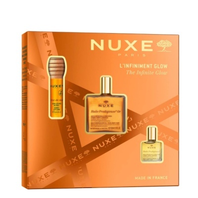 Conjunto cosmético NUXE Paris L'INFINIMENT GLOW em caixa laranja com três produtos visíveis
