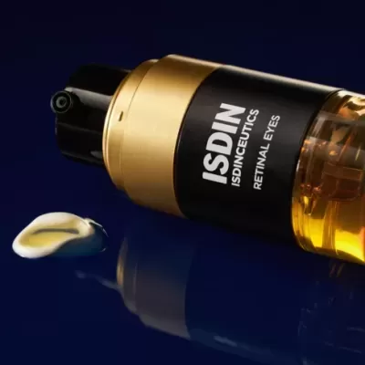 Frasco preto e dourado de ISDINCEUTICS RETINAL EYES com creme branco e azul ao lado