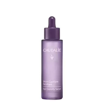 Frasco roxo translúcido com conta-gotas para sérum capilar da Caudalie