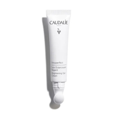 Tubo branco de creme para olhos Caudalie com aplicador esférico e texto preto
