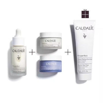 Produtos cosméticos Caudalie Vinoperfect com frasco conta-gotas, cremes em frascos e tubo máscara esfoliante
