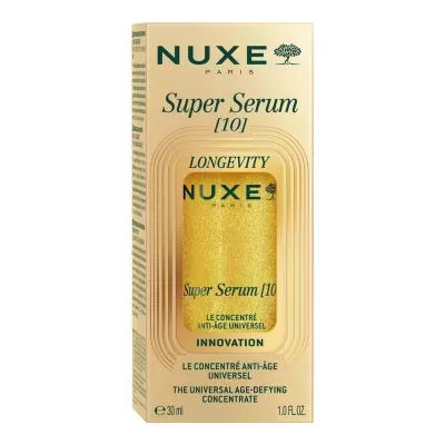 Frasco dourado do sérum anti-idade NUXE dentro de embalagem de cartão bege