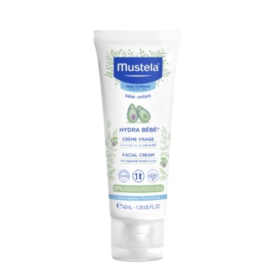 Tubo branco de creme facial Mustela para bebé com imagens de abacates e folhas verdes