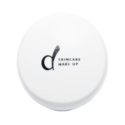 Pote redondo branco com textos SKINCARE MAKE UP e logotipo preto