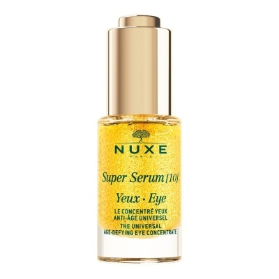 Frasco de sérum dourado para olhos da marca NUXE com tampa dourada.