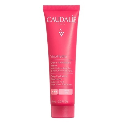 Tubo rosa de hidratante Caudalie com texto branco